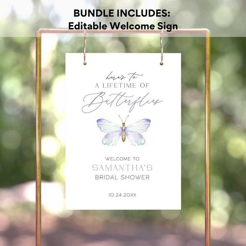 May include: A white welcome sign with a purple butterfly graphic and the text "here's to a lifetime of butterflies". The sign also includes the text "Welcome to Samantha's Bridal Shower 10.24.20XX".