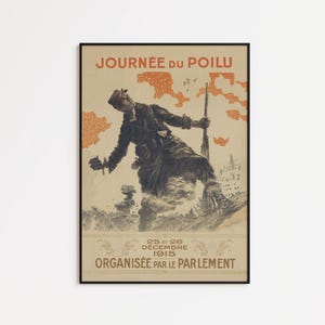 May include: A framed vintage poster titled JOURNÉE DU POILU featuring a charcoal-style illustration of a soldier in uniform holding a rifle. The background includes orange abstract shapes, with text at the bottom reading 25 ET 26 DÉCEMBRE 1915.