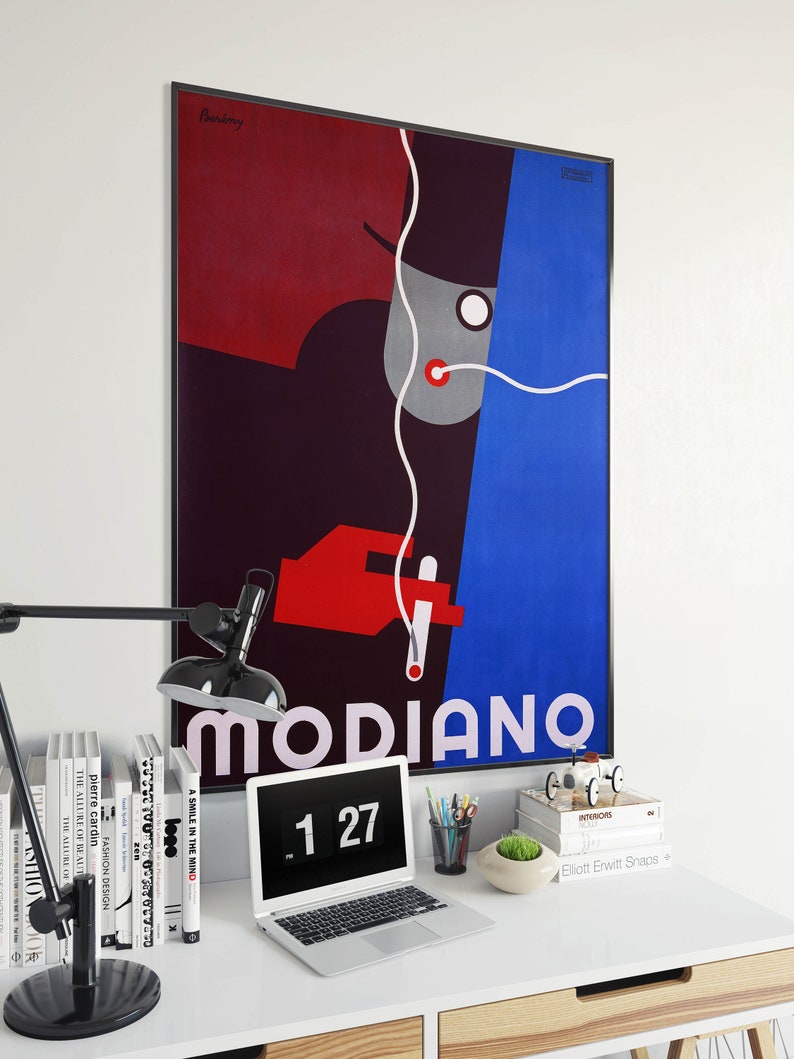 May include: A framed poster with a colorful abstract design featuring a person with a hat and a cigarette. The poster is titled "MODIANO" and has the number "127" printed below the title.