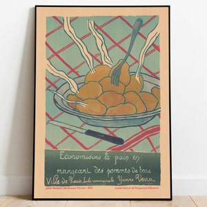 May include: Vintage poster print featuring a plate of potatoes with a fork and knife. The poster has a teal and red checkered background. The text at the bottom reads "Economisons le pain en mangeant des pommes de terre".