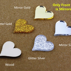 May include: Five heart-shaped acrylic blanks in different finishes: wood, glitter gold, mirror gold, glitter silver, and mirror silver. Only the front side of the mirror finishes is mirrored. "Only Front Side is Mirrored" text is included.