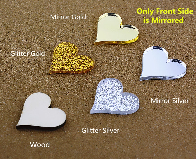 May include: Five heart-shaped acrylic blanks in different finishes: wood, glitter gold, mirror gold, glitter silver, and mirror silver. Only the front side of the mirror finishes is mirrored. "Only Front Side is Mirrored" text is included.