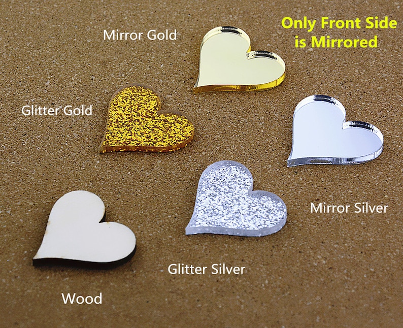 May include: Five heart-shaped acrylic blanks in different finishes: wood, glitter gold, mirror gold, glitter silver, and mirror silver. Only the front side of the mirror finishes is mirrored. "Only Front Side is Mirrored" text is included.