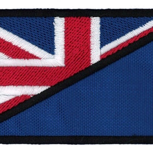 May include: A blue and red embroidered patch with a diagonal line dividing the patch in half. The top half of the patch features a red, white, and blue Union Jack flag. The bottom half of the patch is solid blue.