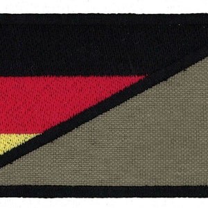 May include: A black, red, and yellow German flag patch with a diagonal cut on a gray background. The patch has a black border.