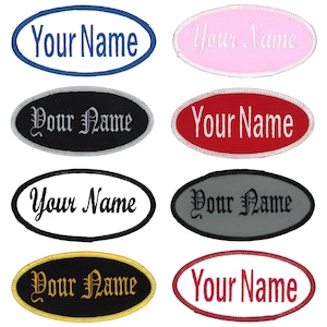 May include: Twelve oval-shaped embroidered patches with white text that reads "Your Name" in various fonts and colours. The patches are on a white background.