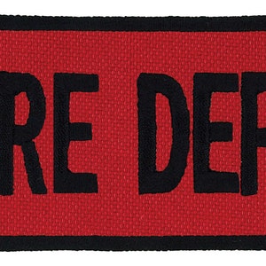 May include: Red rectangular patch with black border and the text "FIRE DEPT" in black.