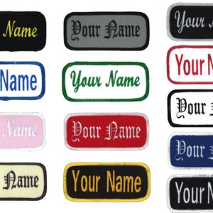 May include: A set of ten iron-on name patches in various colors and fonts. The patches are rectangular and feature the text "Your Name" in different styles, including script, block letters, and a combination of both.