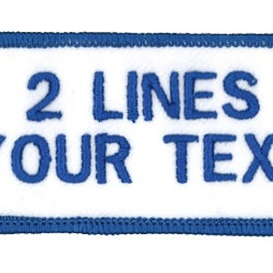 May include: White rectangular patch with a blue border. The patch has blue embroidered text that reads "2 LINES YOUR TEXT".