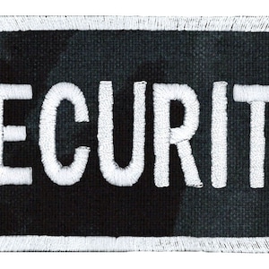May include: White embroidered "SECURITY" text on a black patch with a white border.