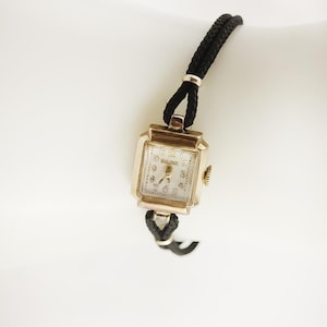 Vintage Bulova Watch | 10K Gold Filled Wristwatch with Black Cord Band | Mid Century Collectible Timepiece | Seventeen Jewel Swiss Movement