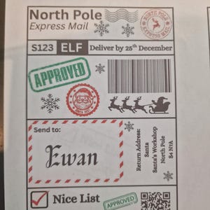 May include: A festive North Pole Express Mail label with the name "Ewan" in elegant script. Features "Approved" stamps, snowflakes, and a Santa Claus graphic. Includes a "Nice List" checkmark and a barcode.
