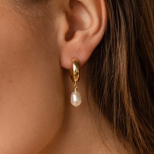Pearl Drop Huggie Hoops by Caitlyn Minimalist • Gold Huggie Earrings with Dangling Pearl Charm • Dainty Pearl Jewelry • Bridal Gifts • ER407