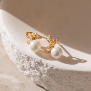 Pearl Bow Stud Earrings by Caitlyn Minimalist • Dainty Diamond Earrings in Gold & Silver • Coquette Jewelry • Bridesmaid Gift • ER312