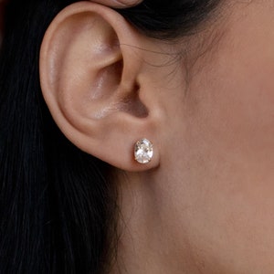 Gold oval stud best sale earrings