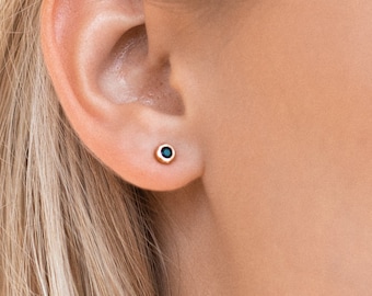 single black stone earrings in gold
