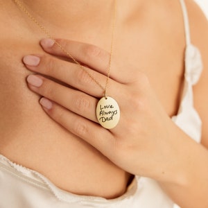 May include: Gold necklace with an oval pendant that says "Love Always Dad" in handwritten script.