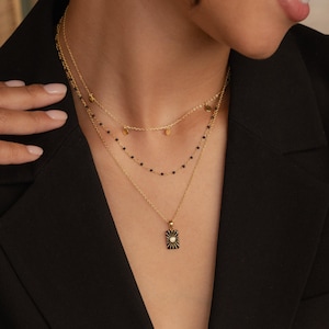 Czarny, warstwowy zestaw naszyjników Caitlyn Minimalistyczny • Delikatne czarne naszyjniki z zawieszkami • Naszyjnik choker z koralików • Wyrazista biżuteria • Prezent dla niej