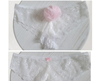 Pastel pink clip on bunny tail panties.