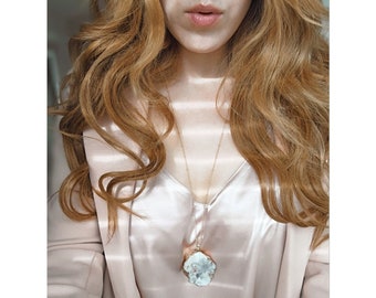 Kelly. A gold and white druzy statement necklace.