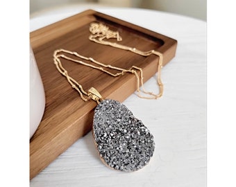 Michelle. A gold and silver druzy statement necklace.