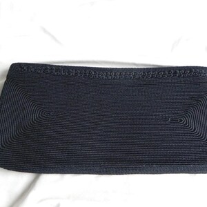 Cartera de mano de tres compartimentos de tela Corde' negra