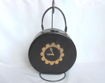Bolsa de mão redonda vintage MCM (meados do século XX), em couro preto, com design exclusivo e tema de relógio.