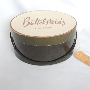 Scatola per cappelli rotonda vintage anni &#39;50 nera e avorio di Battelstein&#39;s of Houston, scatola per cappelli, scatola per parrucche, scatola per articoli artigianali, arredamento per la casa