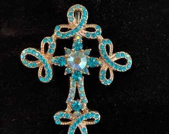 Vintage Kirks Folly large teal stone cross pendant