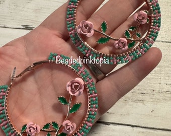 Floral beaded hoop earrings.