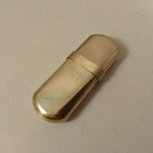 Vintage ,tiny lighter...brass miniature, needs new Flint and Zippo oil, if you like to use it,,,,