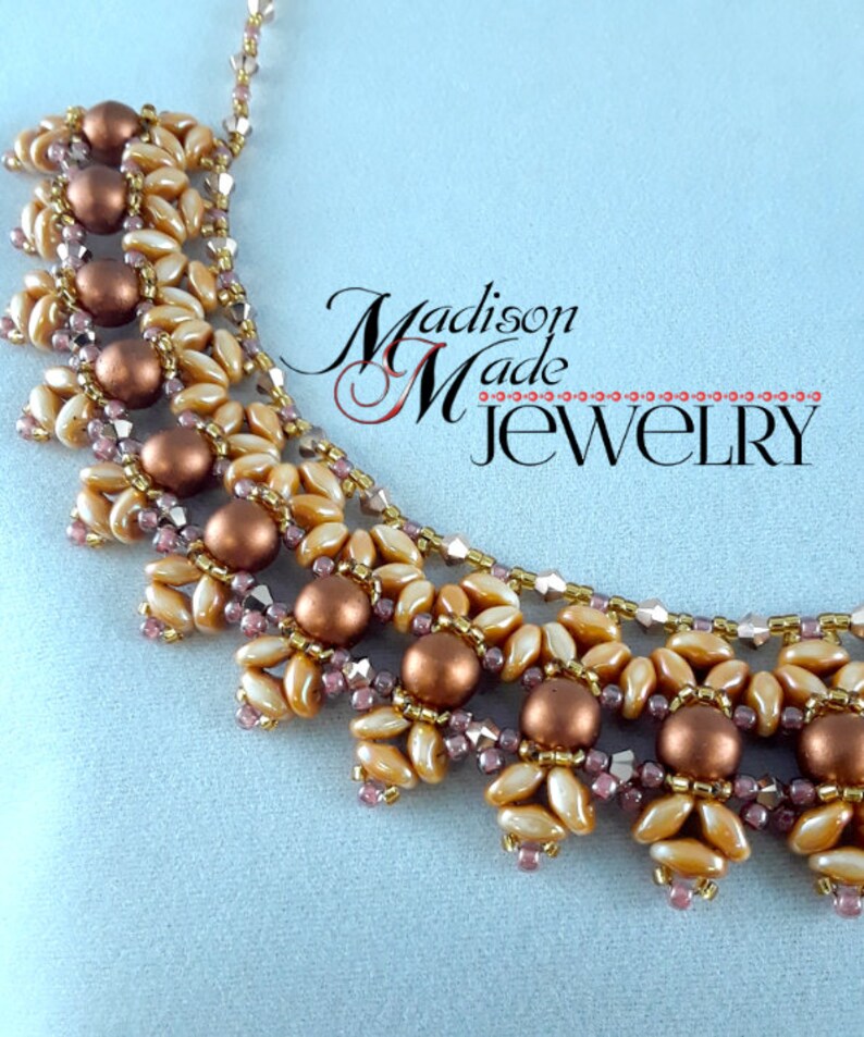 May include: A gold and brown beaded necklace with a delicate, intricate design. The necklace is made with small, round beads and features a repeating pattern of flower-like shapes. The necklace is a statement piece that would add a touch of elegance to any outfit.