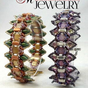 May include: Two beaded bracelets. One bracelet features green, gold, and brown beads in a geometric pattern. The other bracelet has purple and silver beads. The bracelets are displayed on clear stands. The text "Madison Made Jewelry" is at the top.