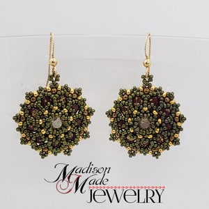 May include: A pair of beaded earrings with a floral design. The earrings feature a combination of dark green, gold, and burgundy beads. The earrings are suspended from gold-colored ear wires. The text "Madison Made Jewelry" is at the bottom.