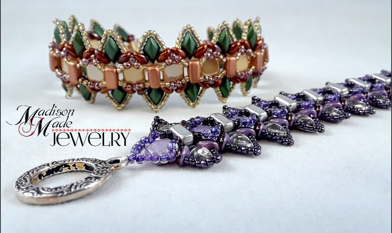 May include: Two beaded bracelets. One is a wide bracelet with green, brown, and beige beads. The other is a long, purple beaded necklace with a silver clasp. The bracelets are handmade jewelry.