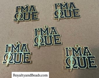 New Que charm