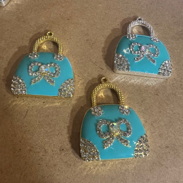 3 blue purse charms