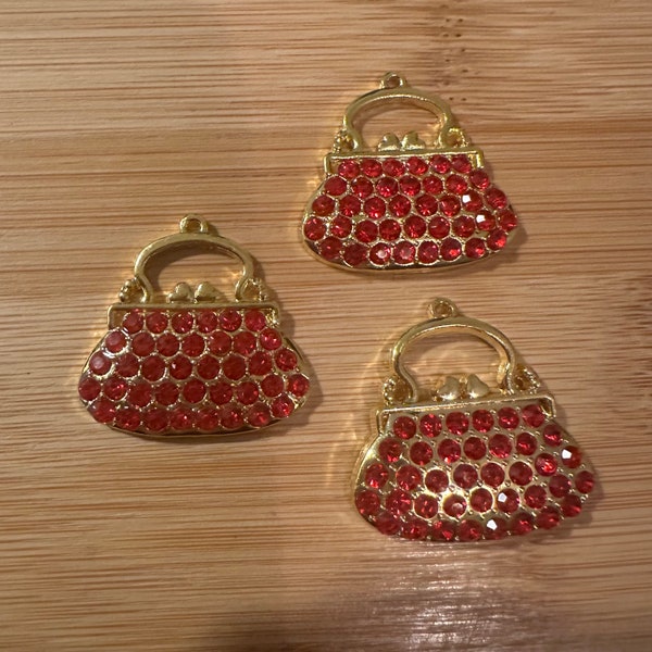 3 red purse charms