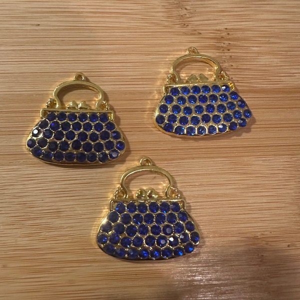 3 blue purse charms