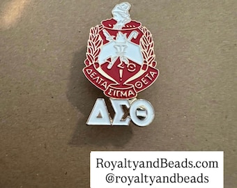 Gold Delta Sigma Theta pin.