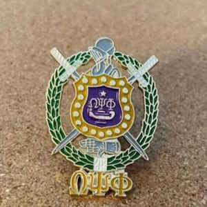 Omega Psi Phi lapel pin.