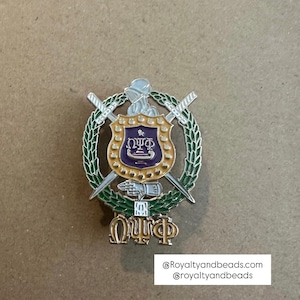 Omega Psi Phi lapel pin.