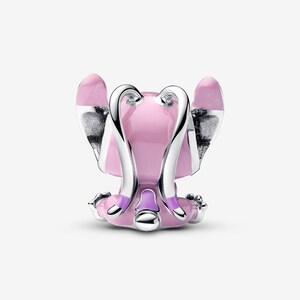 May include: A pink and silver charm featuring a stylized angel design. The charm has a pink body with silver wings and accents. The design is detailed with a smooth, polished finish, and is likely made of metal.