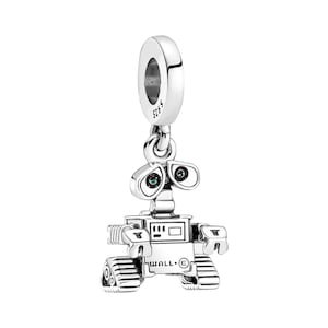 May include: A silver charm featuring WALL-E, the robot from the Disney Pixar film WALL-E. The charm has green and blue eyes and the text "WALL-E" on the bottom.
