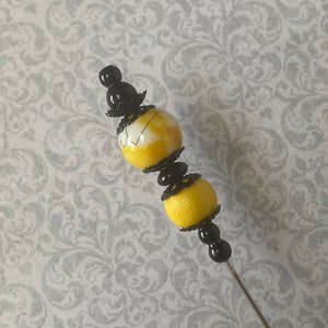 Long Hat Pin }{ Yellow and Black Glass }{ 8” Sturdy Steel Stick to Use and Wear }{ Includes Clutch }{ Derby Hatpin HP4162