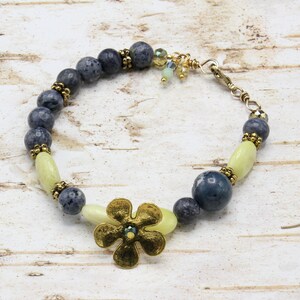 Beaded Bracelet with Natural Stone, Crystals, and a Large Flower Metal Piece; in Blue, Yellow, Gold Colors