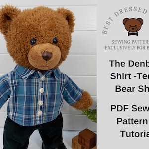 Build a bear teddy bear wearing a blue checked shirt and black trousers.