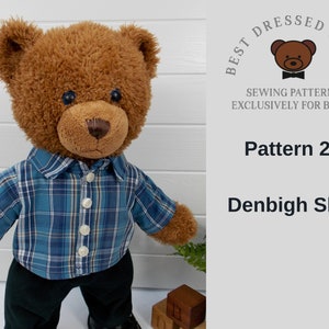 Build a bear teddy bear wearing a blue checked shirt and black trousers.