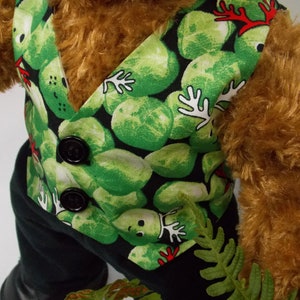 Build a bear teddy bear wearing a green patterned waistcoat, black trousers and black shoes