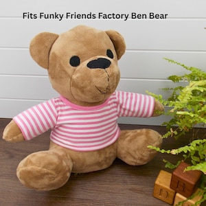 Brown Funky Friends Factory Ben teddy bear wearing a pink & white striped t-shirt. The text on the image reads 'Fits Funky Friends Factory Ben Bear' refers to the fact that the t-shirt the teddy is wearing is made with a sewing pattern from Best Dressed Bears